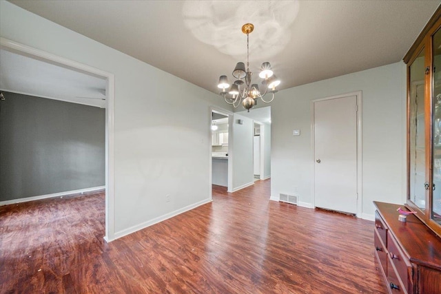 875 S Yates Rd Unit 4, Memphis, TN 38120 - unfurnished dining area with dark wood finished floors and a chandelier