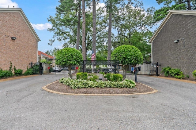 875 S Yates Rd Unit 4, Memphis, TN 38120 - view of asphalt street featuring a gate and a gated entry