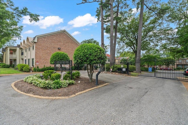 875 S Yates Rd Unit 4, Memphis, TN 38120 - view of asphalt road featuring a gate and a gated entry