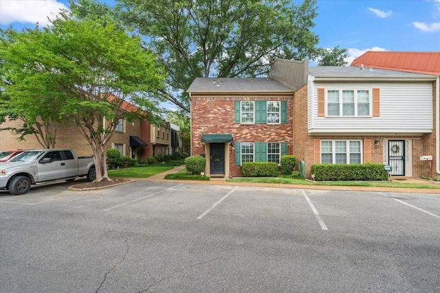 875 S Yates Rd Unit 4, Memphis, TN 38120 - view of property featuring brick siding and uncovered parking