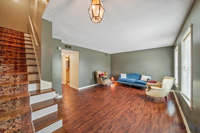 875 S Yates Rd Unit 4, Memphis, TN 38120 - living area featuring stairs, wood finished floors, and a textured ceiling