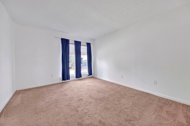 6787 Quail Hollow Ct Unit 4, Memphis, TN 38120 - spare room with carpet and a textured ceiling