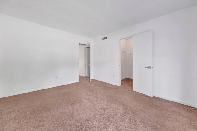6787 Quail Hollow Ct Unit 4, Memphis, TN 38120 - unfurnished bedroom with carpet floors, a spacious closet, and a closet