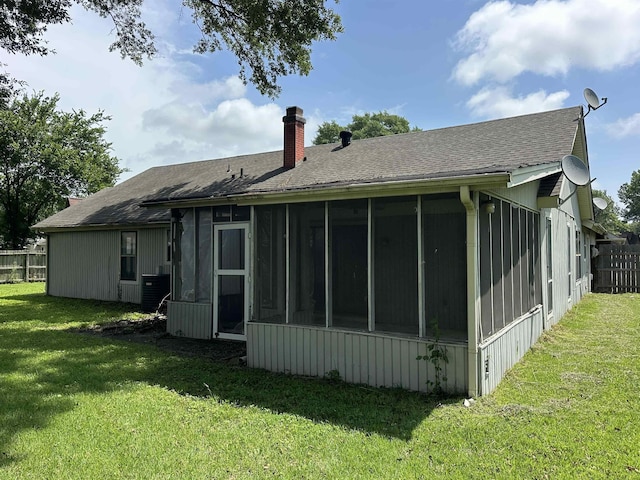 4607 Blue Willow Rd, Memphis, TN 38141 - rear view of property featuring a chimney, a sunroom, and a shingled roof