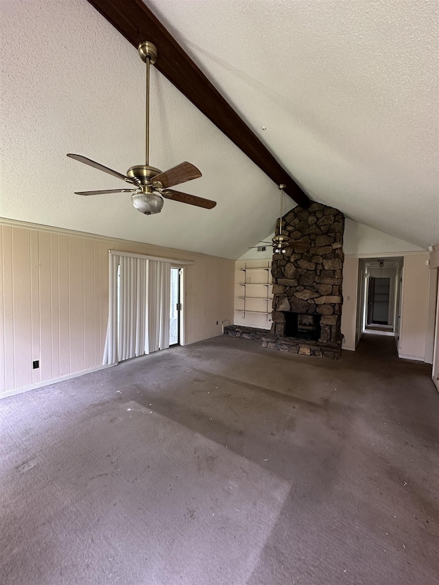 4607 Blue Willow Rd, Memphis, TN 38141 - unfurnished living room with ceiling fan, a textured ceiling, carpet flooring, wooden walls, and a fireplace