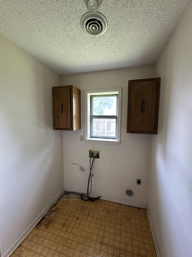 4607 Blue Willow Rd, Memphis, TN 38141 - washroom with light flooring, electric dryer hookup, hookup for a washing machine, and cabinet space