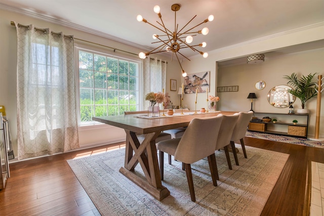 8986 Stratfield Cv, Germantown, TN 38139 - dining space featuring a chandelier, ornamental molding, and wood finished floors