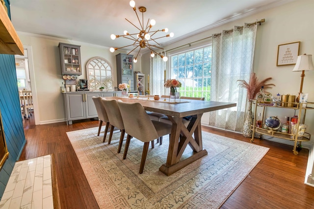 8986 Stratfield Cv, Germantown, TN 38139 - dining space featuring a chandelier, crown molding, and dark wood finished floors