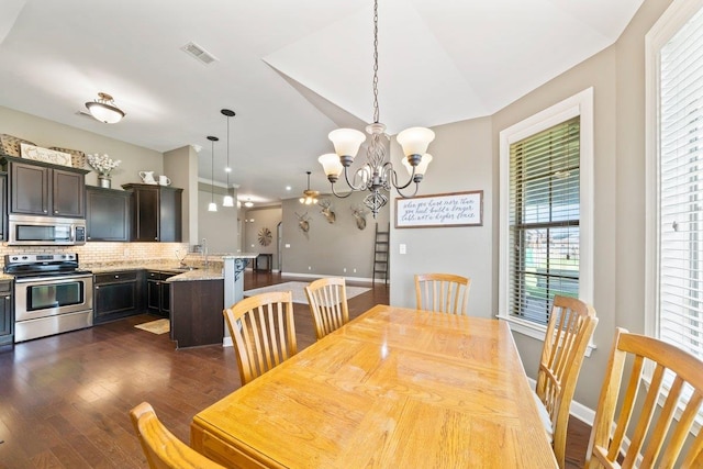 70 Shady Pine Cv, Oakland, TN 38060 - dining room featuring dark wood finished floors and a chandelier