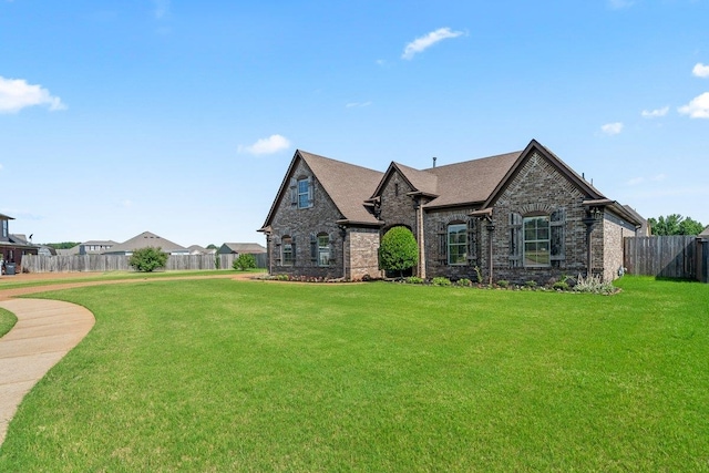 70 Shady Pine Cv, Oakland, TN 38060 - french country inspired facade with brick siding and a shingled roof