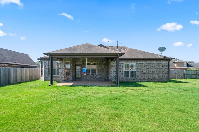 70 Shady Pine Cv, Oakland, TN 38060 - back of property with a patio, brick siding, a fenced backyard, and a shingled roof