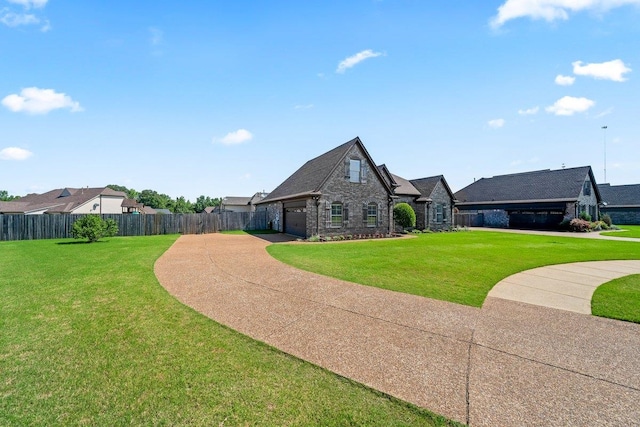 70 Shady Pine Cv, Oakland, TN 38060 - view of front of property featuring driveway, stone siding, and an attached garage