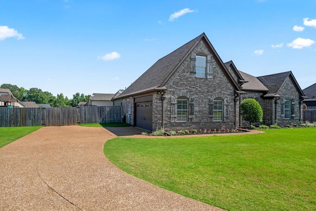 70 Shady Pine Cv, Oakland, TN 38060 - view of front of home with driveway, a garage, and brick siding