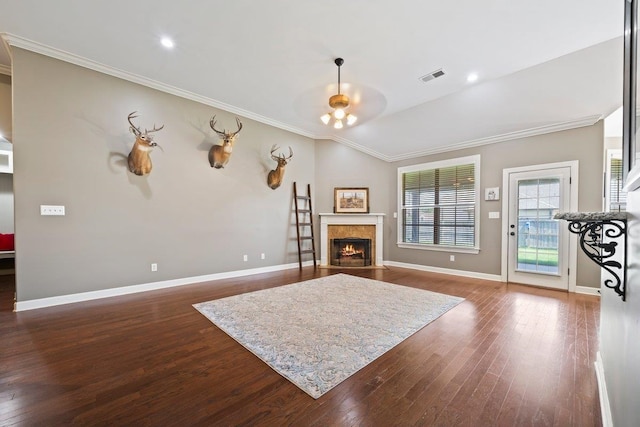 70 Shady Pine Cv, Oakland, TN 38060 - living room with dark wood-type flooring, ornamental molding, a fireplace with flush hearth, and vaulted ceiling