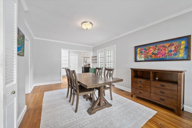 1978 Tutwiler Ave, Memphis, TN 38107 - dining room featuring crown molding and wood finished floors