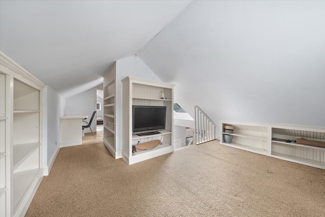 1978 Tutwiler Ave, Memphis, TN 38107 - unfurnished living room with carpet floors, vaulted ceiling, and built in shelves