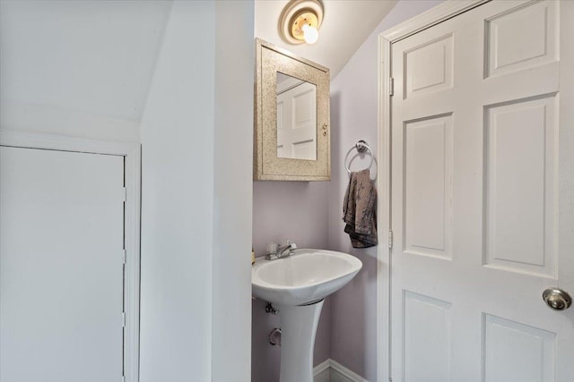 1978 Tutwiler Ave, Memphis, TN 38107 - bathroom featuring lofted ceiling