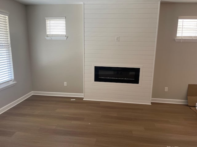 1998 Cloverdale Dr, Memphis, TN 38114 - unfurnished living room with dark wood-style flooring and a fireplace