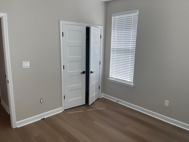 1998 Cloverdale Dr, Memphis, TN 38114 - unfurnished bedroom with dark wood-type flooring and a closet