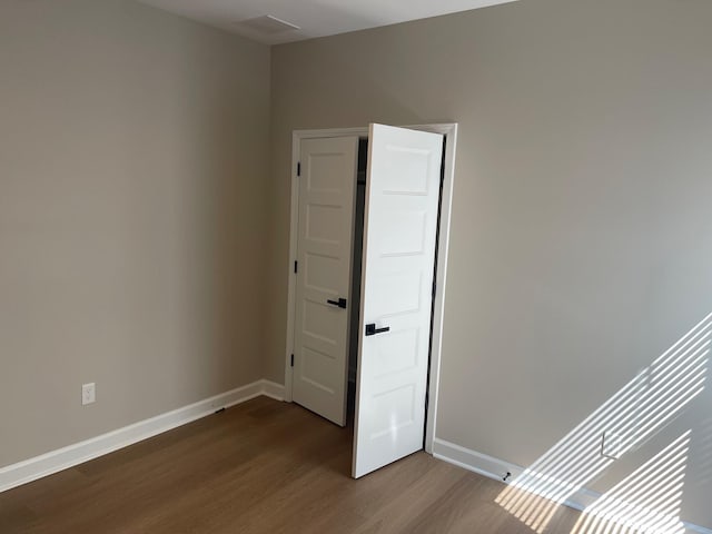 1998 Cloverdale Dr, Memphis, TN 38114 - unfurnished room with dark wood-type flooring and baseboards