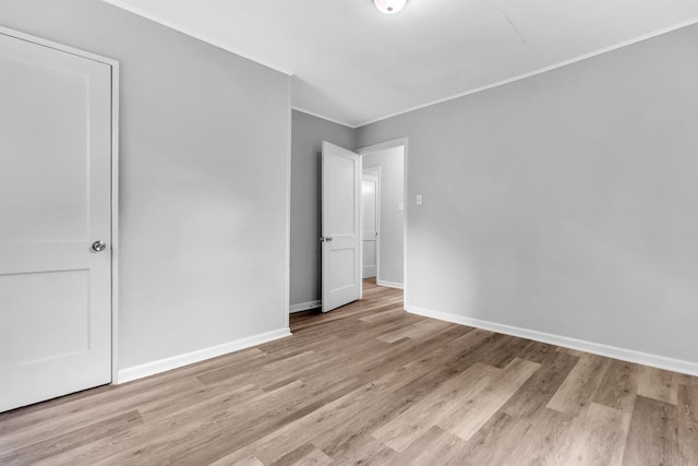 849 Restbrook Ave, Memphis, TN 38127 - unfurnished bedroom featuring ornamental molding and wood finished floors