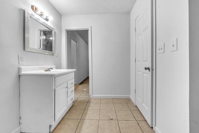 3594 Sunrise St, Memphis, TN 38127 - bathroom with vanity, tile patterned floors, and a textured ceiling