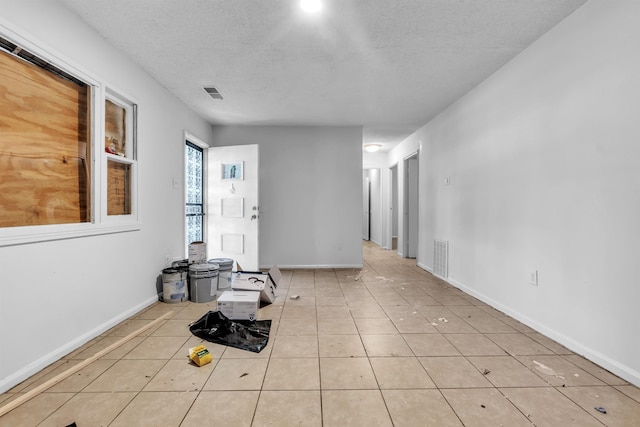 3594 Sunrise St, Memphis, TN 38127 - unfurnished room featuring a textured ceiling and light tile patterned floors