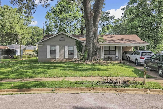 646 Semple Ave, Memphis, TN 38127 - view of front of home featuring an attached carport, brick siding, and driveway
