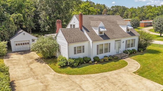 117 N High St, Waynesboro, TN 38485 - cape cod house with an outdoor structure, concrete driveway, a front lawn, a shingled roof, and a garage