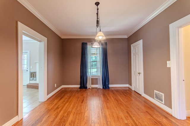 117 N High St, Waynesboro, TN 38485 - empty room with light wood-style floors and ornamental molding