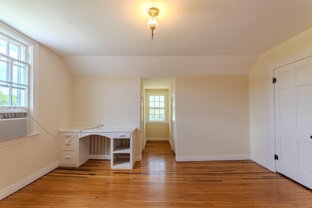 117 N High St, Waynesboro, TN 38485 - unfurnished bedroom with light wood-style floors, lofted ceiling, and cooling unit