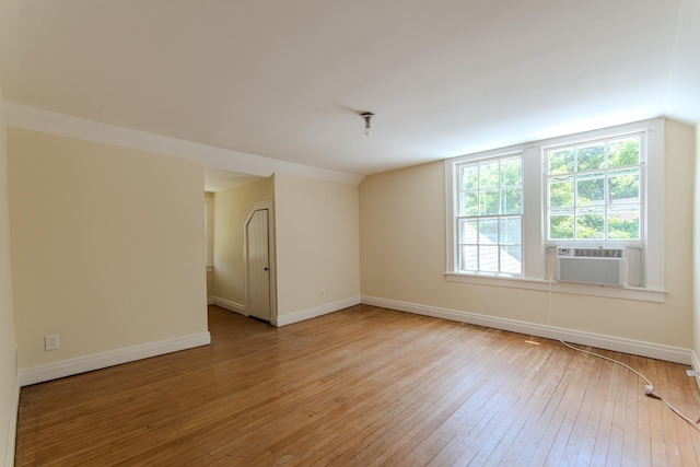 117 N High St, Waynesboro, TN 38485 - spare room with light wood finished floors, cooling unit, and lofted ceiling