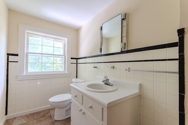 117 N High St, Waynesboro, TN 38485 - bathroom with tile walls, vanity, and wainscoting