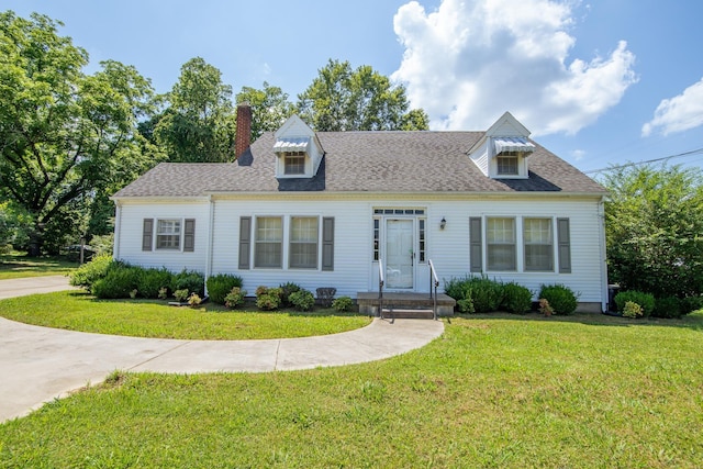 117 N High St, Waynesboro, TN 38485 - cape cod home with a front lawn, a chimney, and a shingled roof