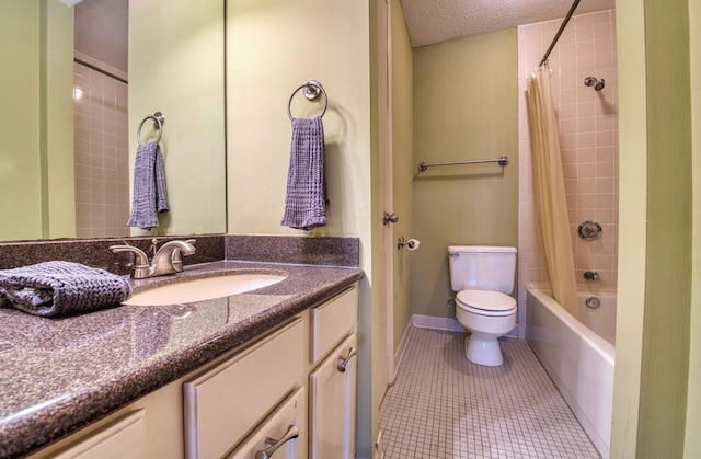 109 N Main St Unit 603, Memphis, TN 38103 - bathroom with vanity, shower / tub combo with curtain, tile patterned floors, and a textured ceiling