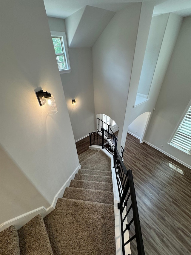 7412 Lost Trail Dr, Cordova, TN 38016 - stairs featuring arched walkways and wood finished floors