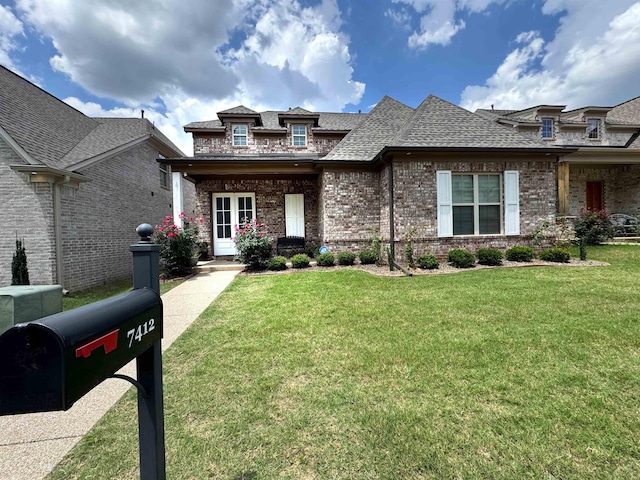 7412 Lost Trail Dr, Cordova, TN 38016 - view of front of home featuring brick siding, a shingled roof, and a front lawn