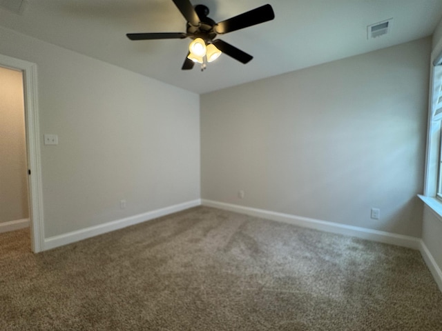 7412 Lost Trail Dr, Cordova, TN 38016 - empty room featuring carpet flooring, a ceiling fan, and healthy amount of natural light