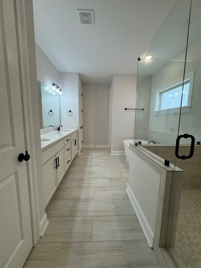 7412 Lost Trail Dr, Cordova, TN 38016 - bathroom with a shower stall, double vanity, and a freestanding bath