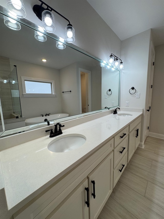 7412 Lost Trail Dr, Cordova, TN 38016 - bathroom featuring a shower stall, double vanity, and a freestanding tub