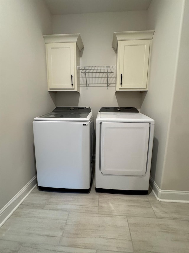 7412 Lost Trail Dr, Cordova, TN 38016 - laundry area with washer and clothes dryer and cabinet space
