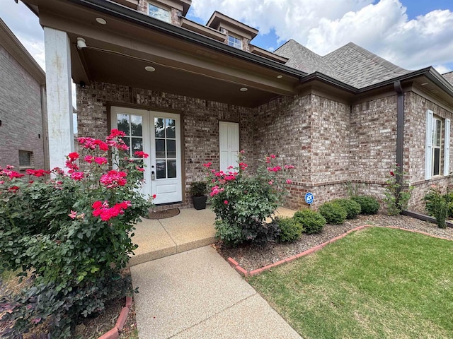 7412 Lost Trail Dr, Cordova, TN 38016 - property entrance with brick siding, a shingled roof, and a lawn