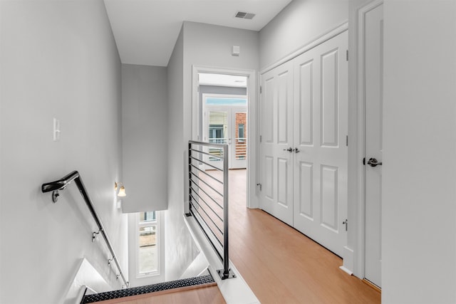 621 Denmark Dr Unit 201, Memphis, TN 38103 - hall featuring an upstairs landing, plenty of natural light, and light wood finished floors