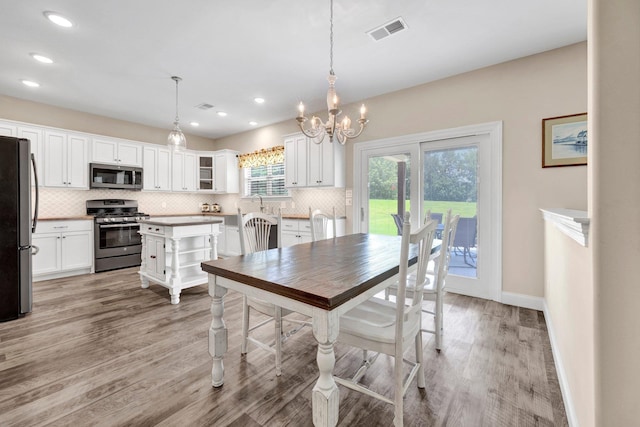 620 N Reid-Hooker Rd, Eads, TN 38028 - dining area with a chandelier, light wood-style flooring, and recessed lighting