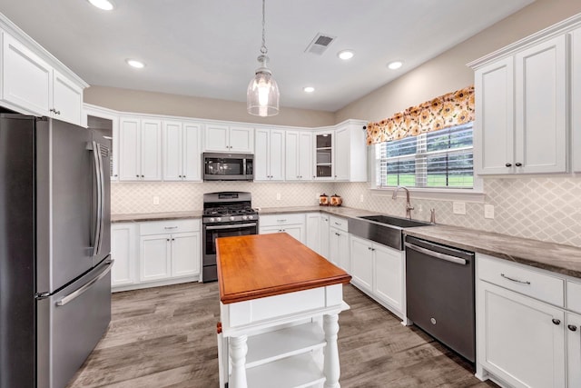 620 N Reid-Hooker Rd, Eads, TN 38028 - kitchen featuring stainless steel appliances, white cabinetry, glass insert cabinets, and recessed lighting