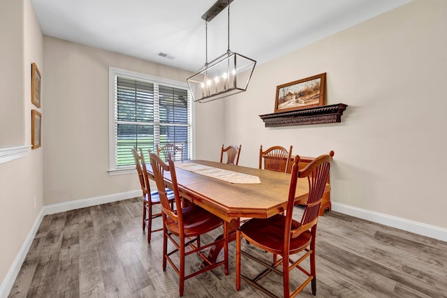 620 N Reid-Hooker Rd, Eads, TN 38028 - dining space with wood finished floors and a chandelier