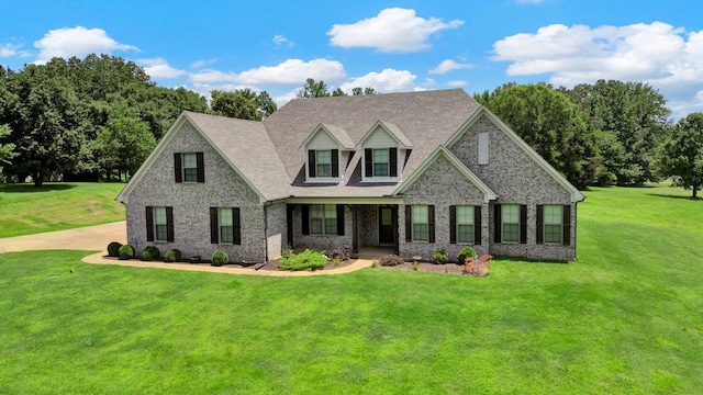 620 N Reid-Hooker Rd, Eads, TN 38028 - cape cod home with a front yard, covered porch, brick siding, and a shingled roof