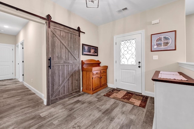 620 N Reid-Hooker Rd, Eads, TN 38028 - entryway with wood finished floors and a barn door