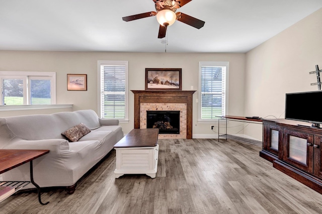 620 N Reid-Hooker Rd, Eads, TN 38028 - living room with wood finished floors, a ceiling fan, and a brick fireplace