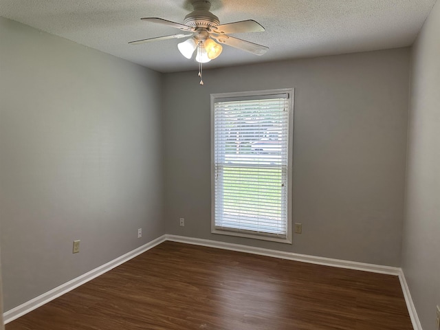 475 Ginny Ln, Collierville, TN 38017 - spare room featuring dark wood-type flooring, a ceiling fan, and a textured ceiling